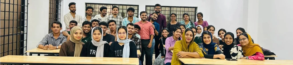 Students and faculty at Prodigy Institute of Management Studies – group photo from tuition classes near me in Kannur