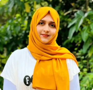 Woman in yellow hijab standing outdoors