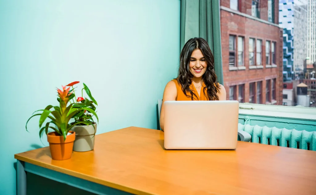 Woman working on laptop in office