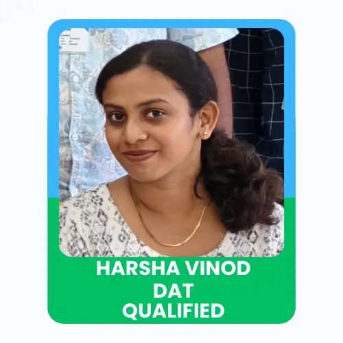 Portrait of Harsha Vinod with a “DAT Qualified” achievement banner.